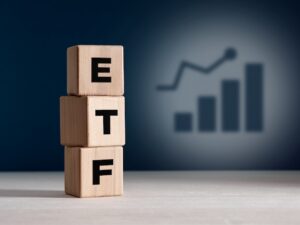 The acronym ETF Exchange Traded Fund on wooden cubes. Business stock market finance index fund