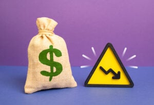 The dollar is a money bag and a downward arrow. Capital is fleeing to safer assets. Investment in the economy declines and liquidity falls. Financial instability