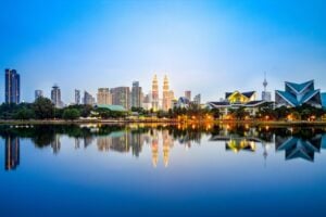 Skyline of Kuala Lumpur by the lake at dusk
