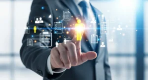 A businessman touches a glowing yellow human icon surrounded by digital recruitment profiles and management checklists.