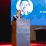 Brunei Finance Minister II Dr Awang Haji Mohd Amin Liew Abdullah speaks at a podium during the 4th Annual ASEAN Forum.