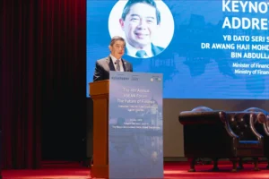 Brunei Finance Minister II Dr Awang Haji Mohd Amin Liew Abdullah speaks at a podium during the 4th Annual ASEAN Forum.