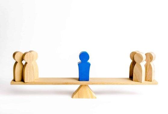 The leader stands on the scales between two groups of people. Resolving conflict situations. The union of two opposing groups of people. Conflict of interest. Leadership, choice side.
