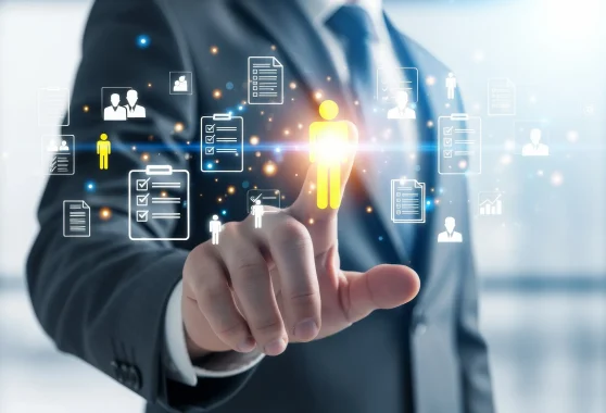 A businessman touches a glowing yellow human icon surrounded by digital recruitment profiles and management checklists.
