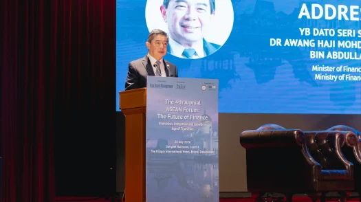Brunei Finance Minister II Dr Awang Haji Mohd Amin Liew Abdullah speaks at a podium during the 4th Annual ASEAN Forum.